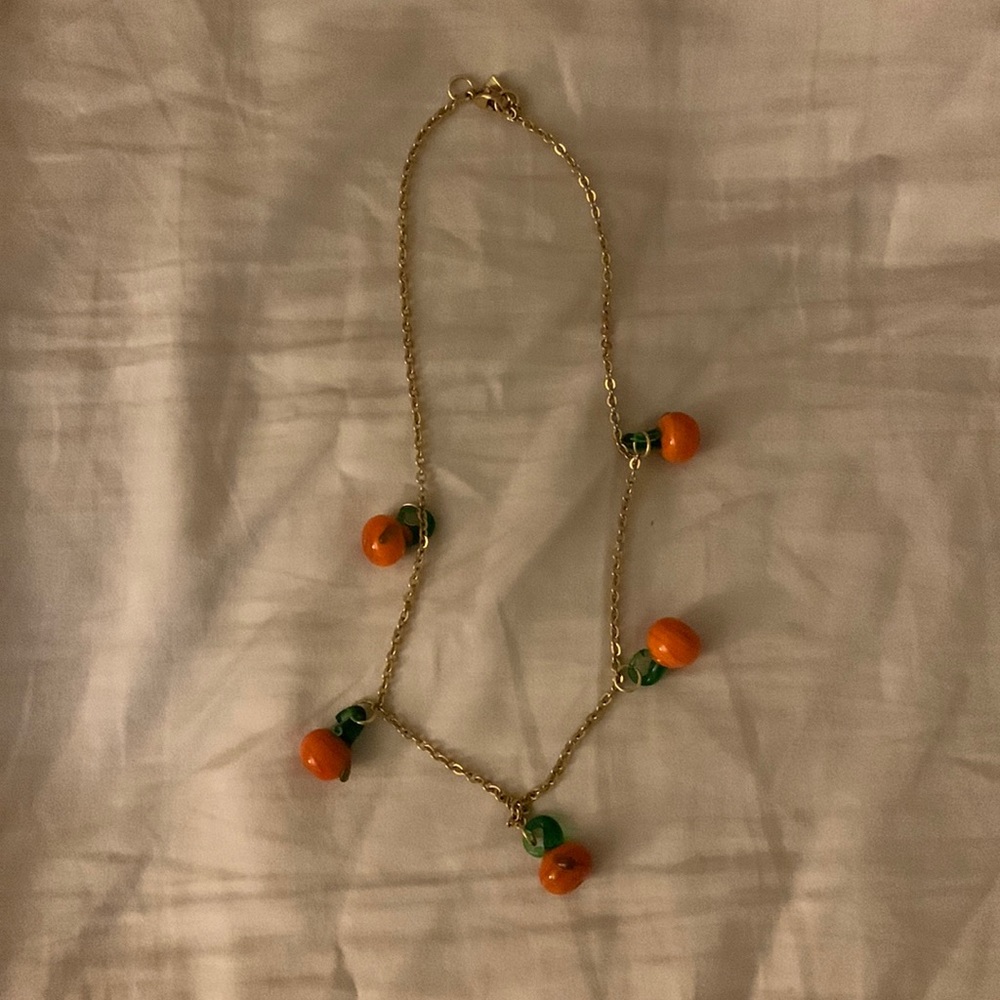 Gold necklace with glass oranges (fruit detail)